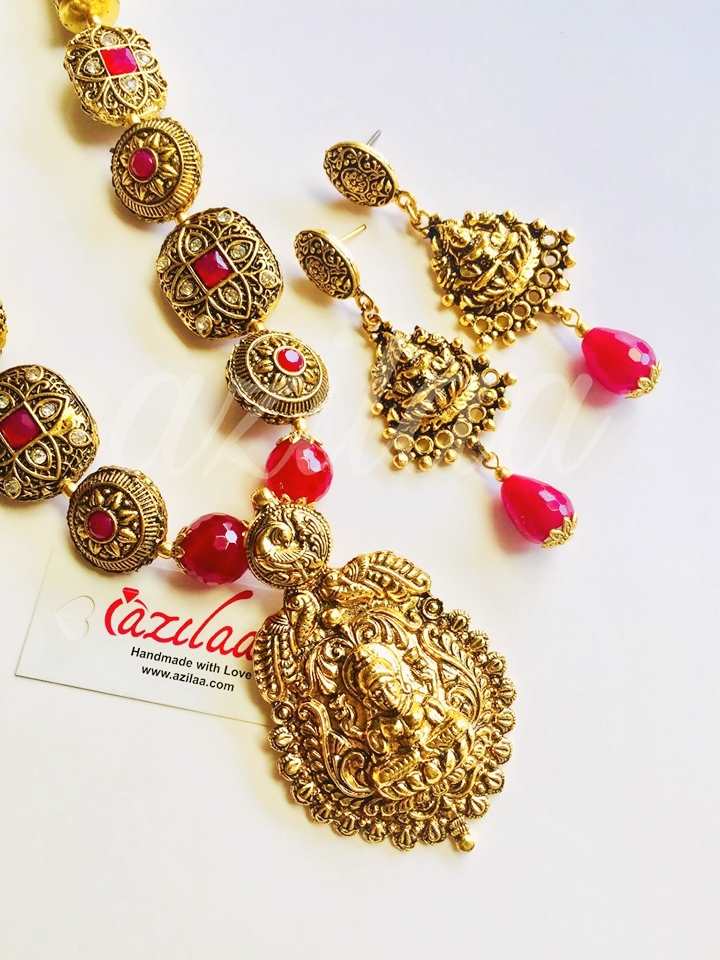 Goddess Laxmi maroon gemstone antique gold tone necklace set at ₹4950 ...